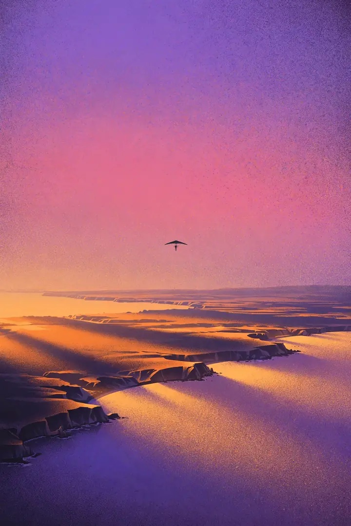 A hang glider over violet cliffs at dusk